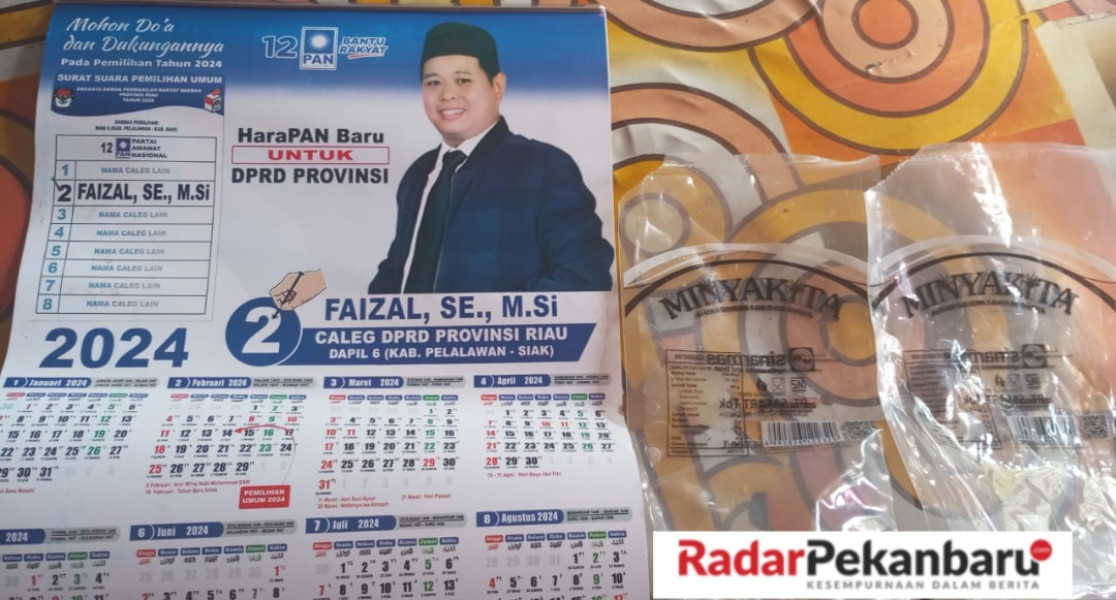 Ketua DPD PAN Pelalawan Bagikan Minyak Goreng Di Kuala Kampar, Faizal Masih Bungkam